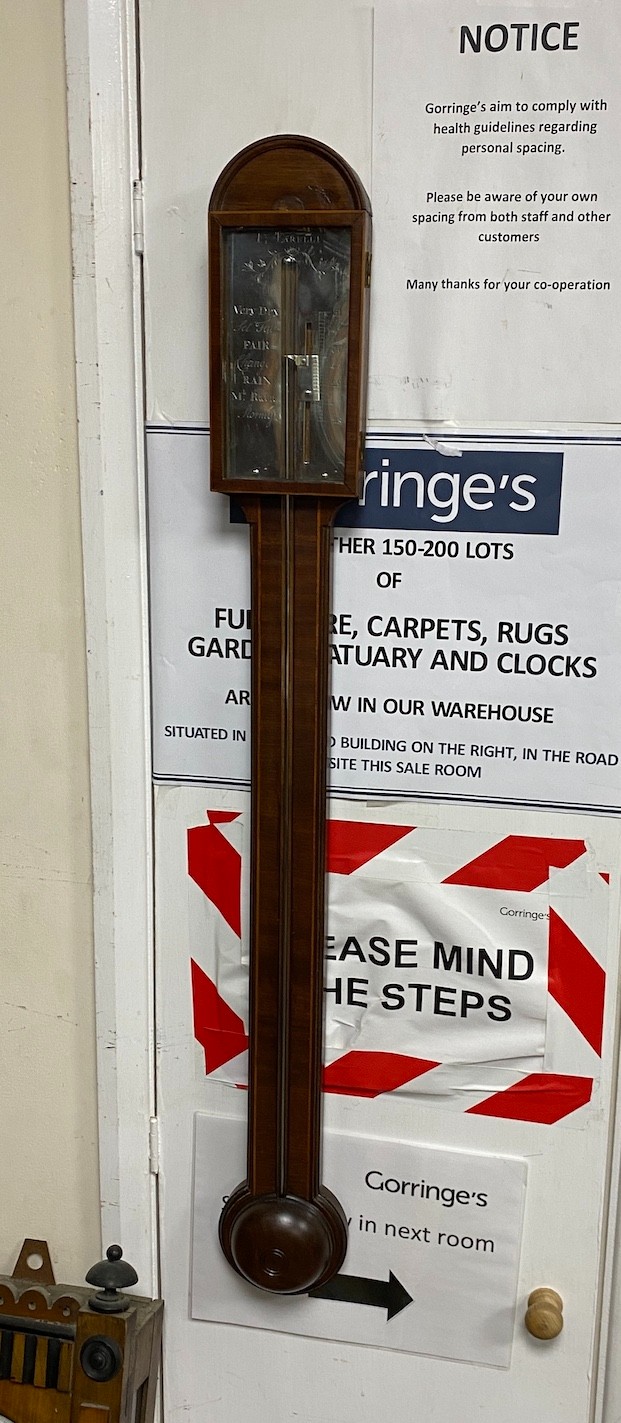 F. Tarelli- A George III mahogany stick barometer with silvered scale, height 96cm.